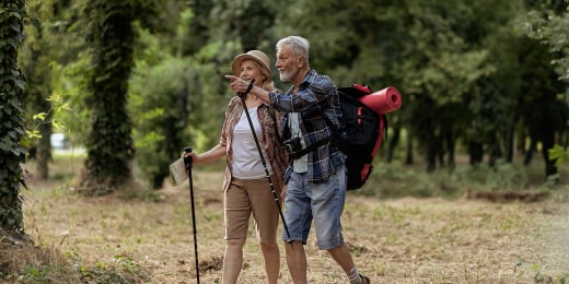 Old couple hiking together